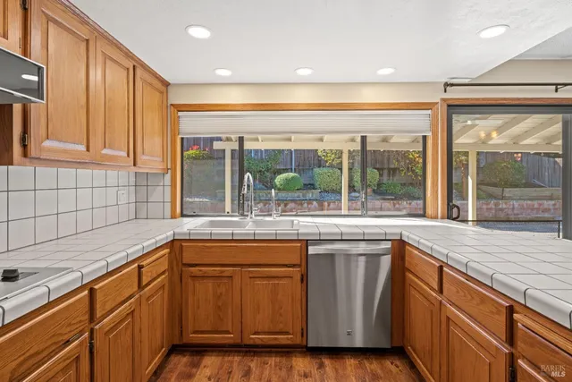 a kitchen with a sink and large window