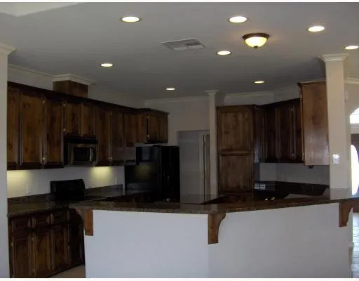 a kitchen with stainless steel appliances a refrigerator and a sink