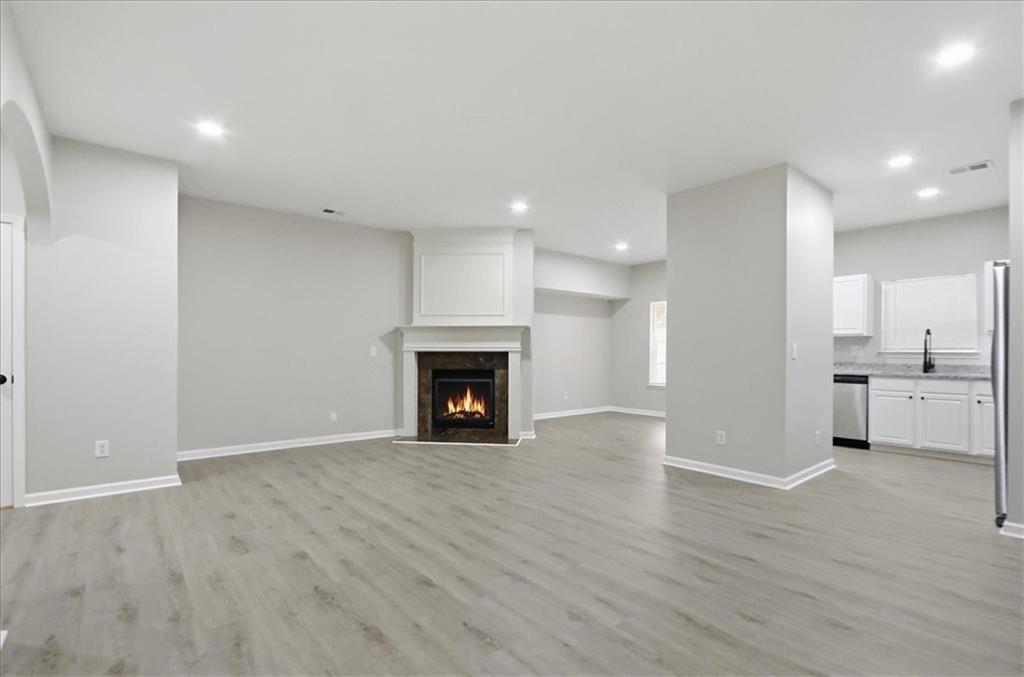 5630 Lawley Road Alpharetta, GA 30022 - Photo 12 of 65 a view of an empty room with a fireplace