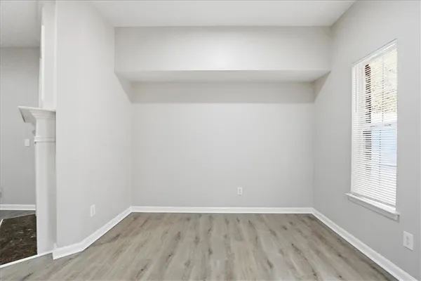 a view of a kitchen with refrigerator stove and wooden cabinets