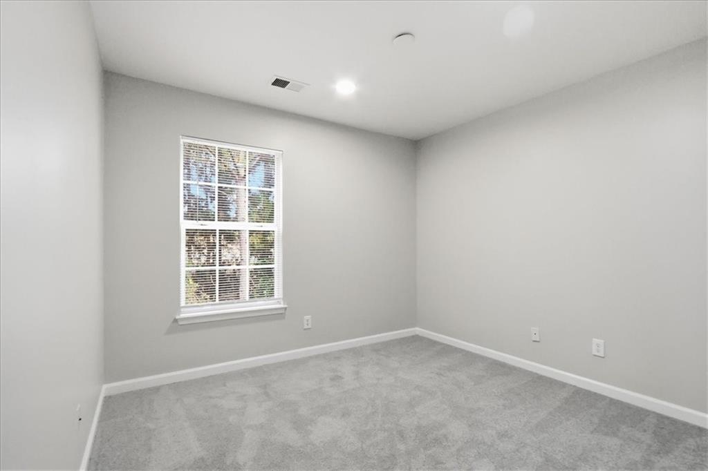5630 Lawley Road Alpharetta, GA 30022 - Photo 29 of 65 an empty room with a window