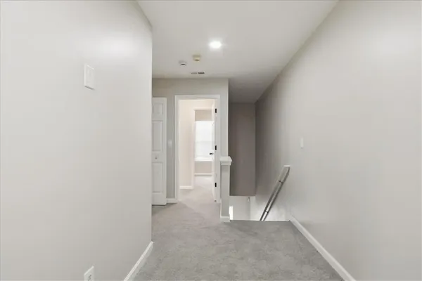 a bathroom with a shower and a sink