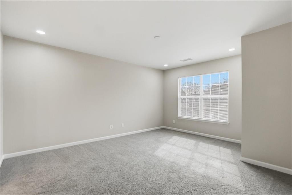 5630 Lawley Road Alpharetta, GA 30022 - Photo 37 of 65 an empty room with a window