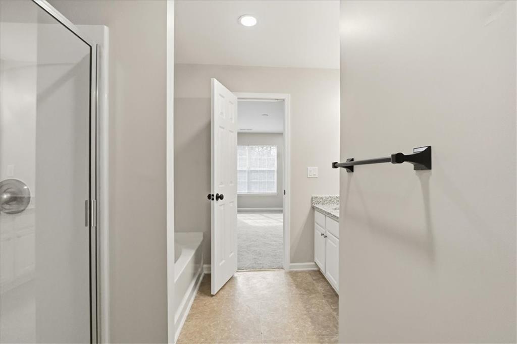 5630 Lawley Road Alpharetta, GA 30022 - Photo 48 of 65 a bathroom with a shower and a sink