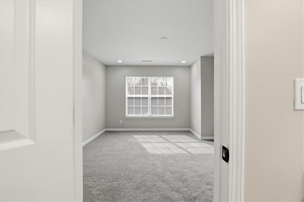 5630 Lawley Road Alpharetta, GA 30022 - Photo 49 of 65 a view of an empty room with a window