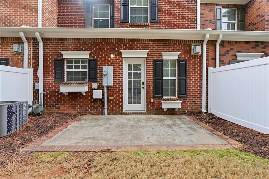 5630 Lawley Road Alpharetta, GA 30022 - Photo 52 of 65 a front view of a house with a large window