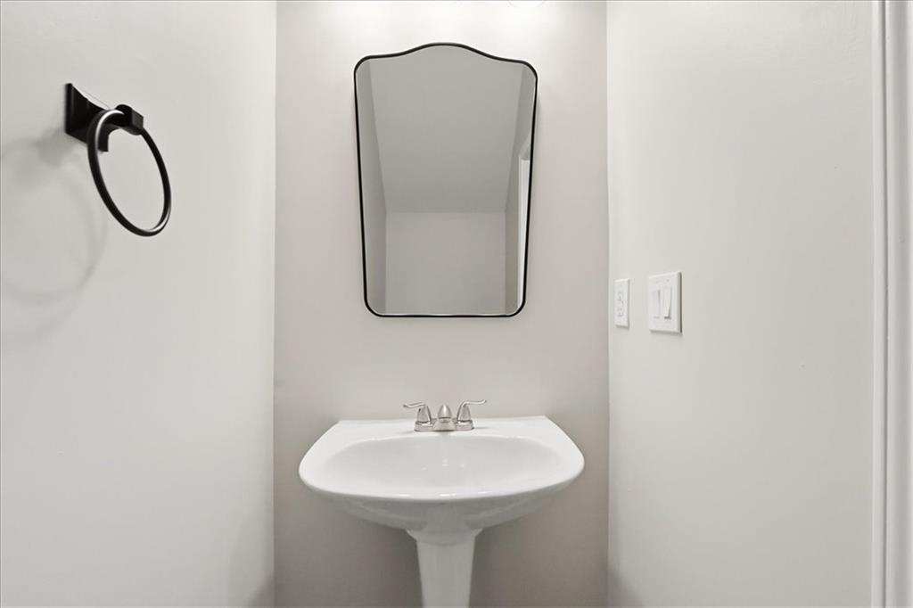 5630 Lawley Road Alpharetta, GA 30022 - Photo 8 of 65 a bathroom with a sink and a mirror