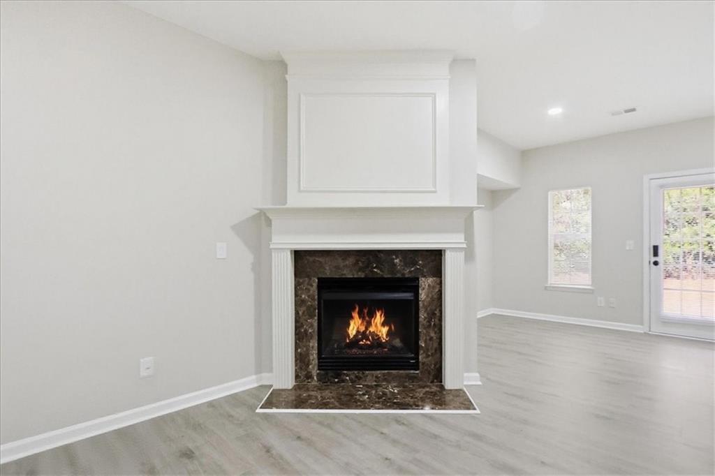 5630 Lawley Road Alpharetta, GA 30022 - Photo 10 of 65 a living room with a fireplace