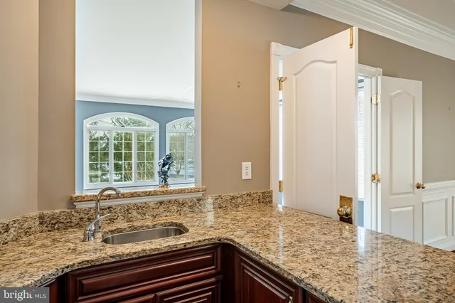 swimming pool view with a garden space