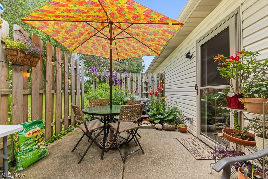 808 Ryan Road, Unit 14 Medina, OH 44256 - Photo 32 of 40 Concrete patio with a wood privacy fence and exterior siding