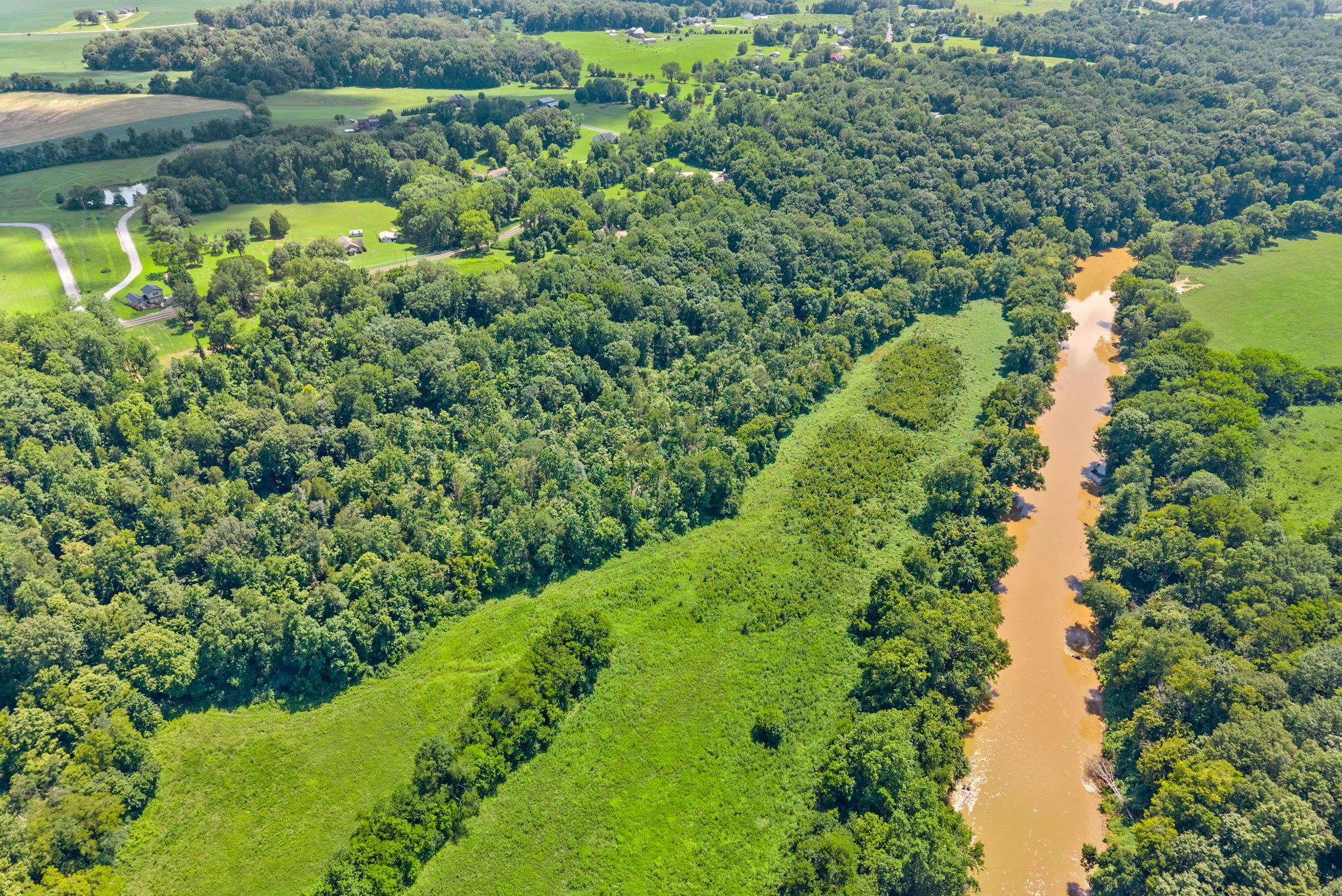 0 Old Clks Sprgfield Road Adams, TN 37010 - Photo 13 of 33 a view of a garden with a lake