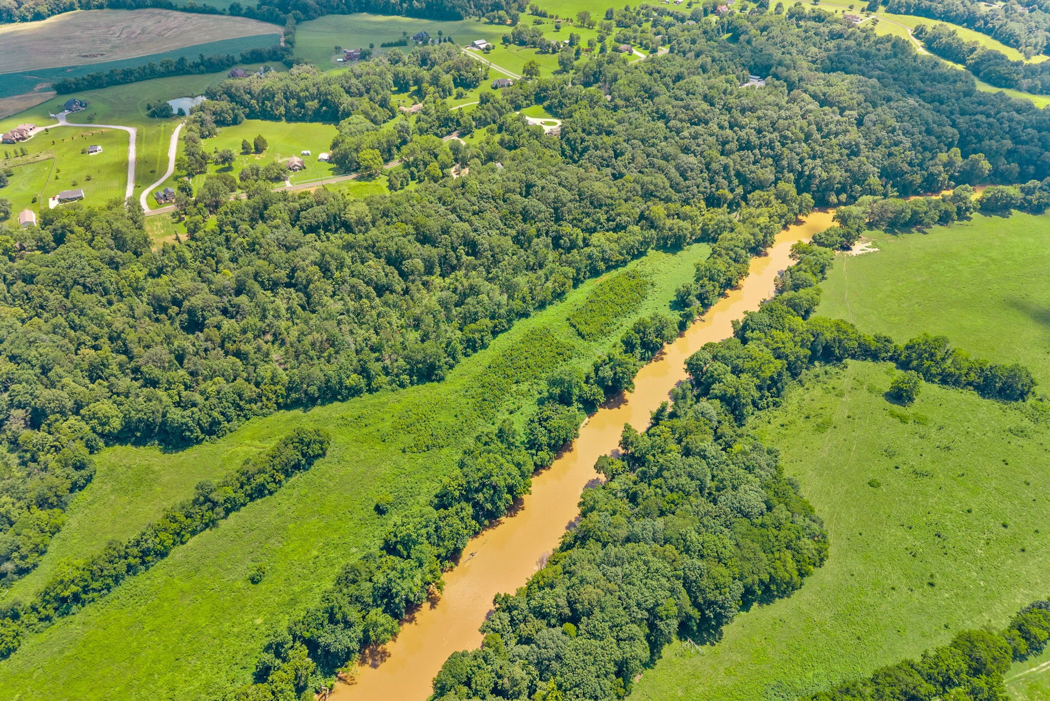 0 Old Clks Sprgfield Road Adams, TN 37010 - Photo 23 of 33 a view of a garden with a lake