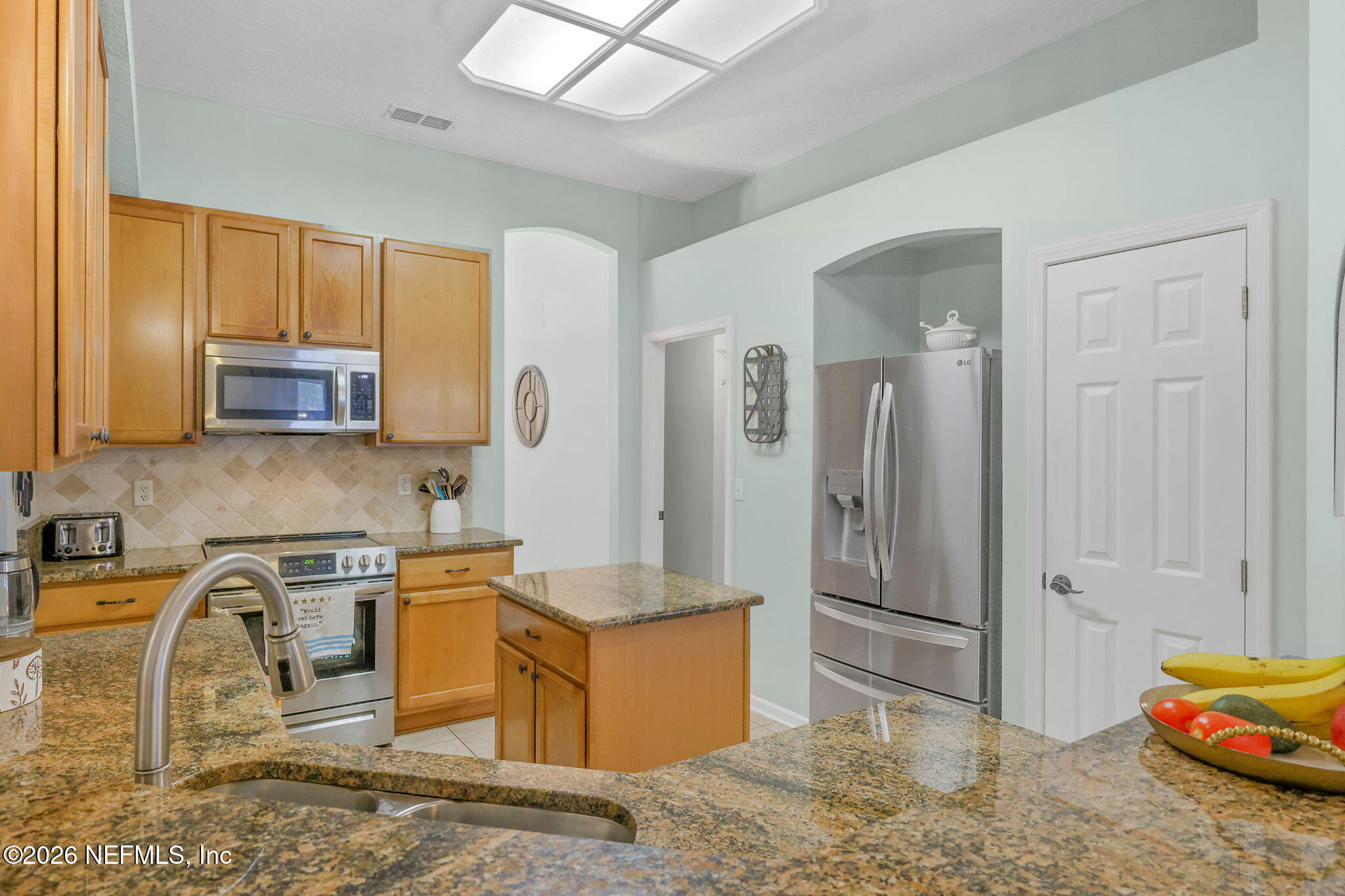 4320 Rye Court St. Johns, FL 32259 - Photo 23 of 60 a kitchen with stainless steel appliances granite countertop a refrigerator a stove and a sink