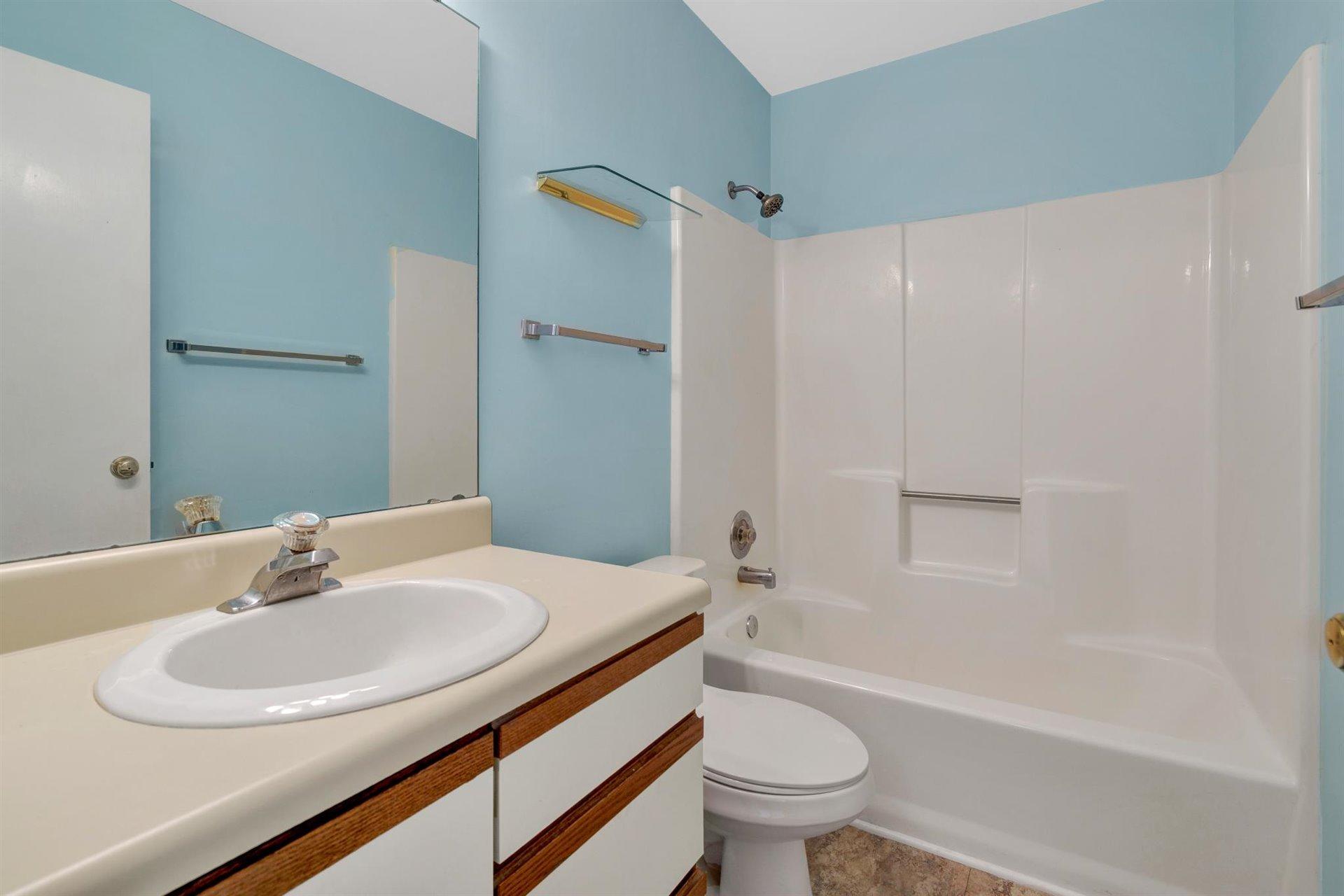 202 Harbor Ridge Drive Goodview, VA 24095 - Photo 11 of 30 a bathroom with a sink and a mirror