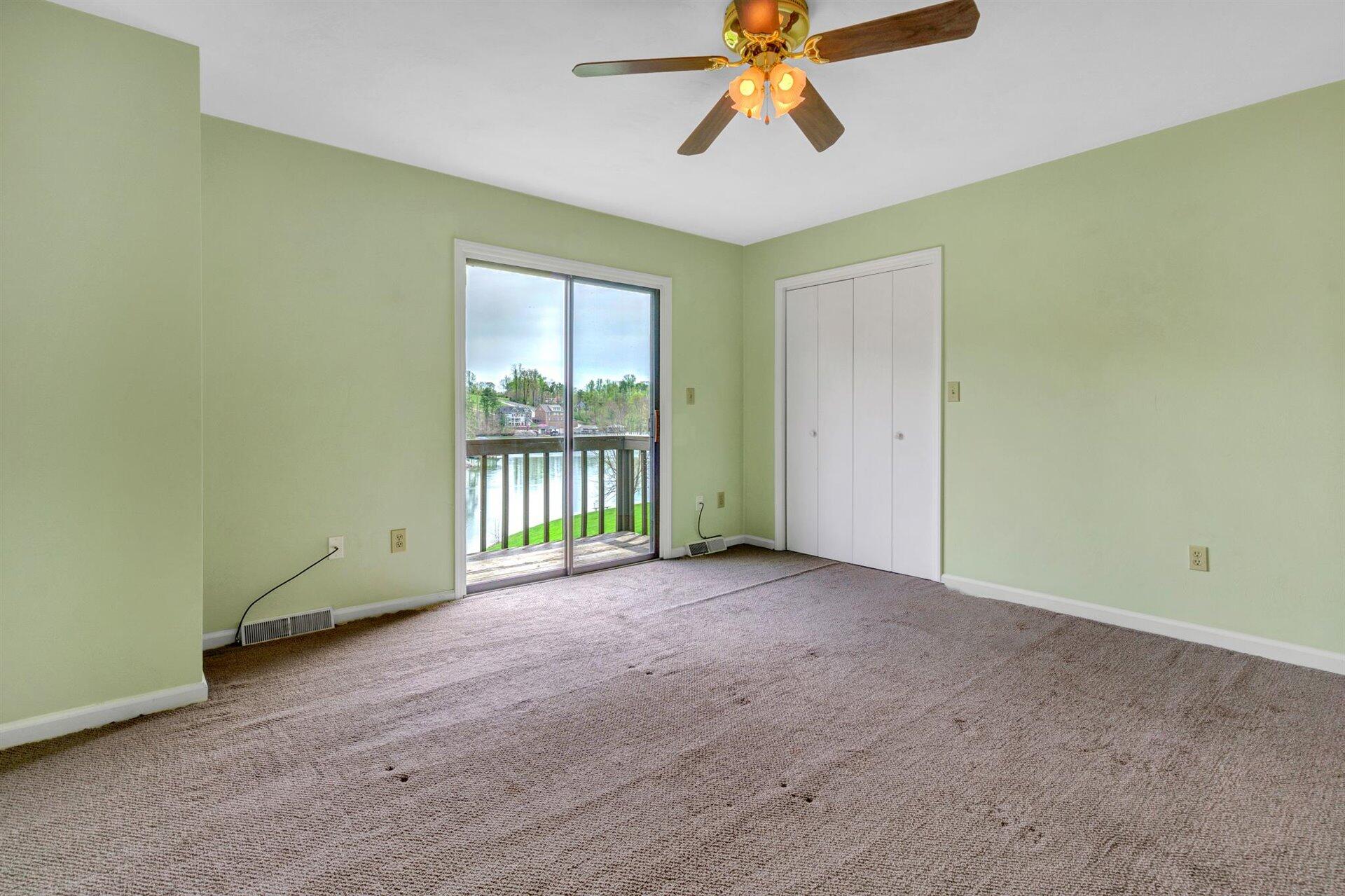 202 Harbor Ridge Drive Goodview, VA 24095 - Photo 15 of 30 a view of an empty room with a window