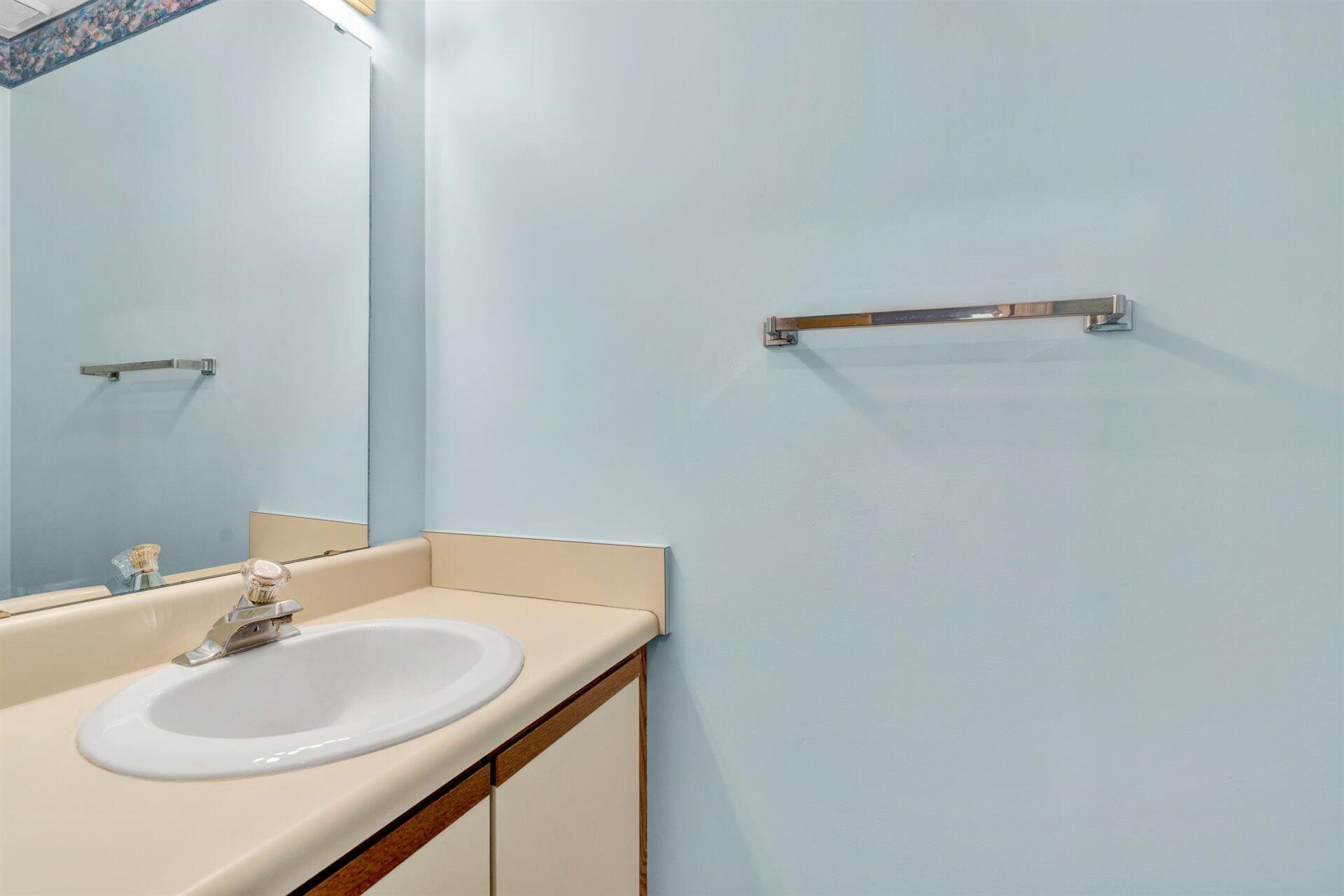 202 Harbor Ridge Drive Goodview, VA 24095 - Photo 7 of 30 a bathroom with a sink and a mirror