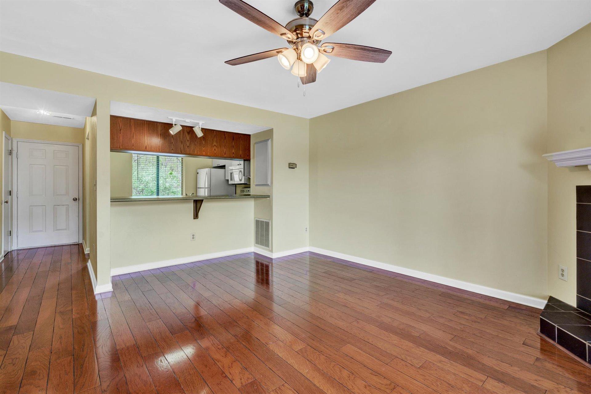 202 Harbor Ridge Drive Goodview, VA 24095 - Photo 9 of 30 wooden floor in an empty room with a window