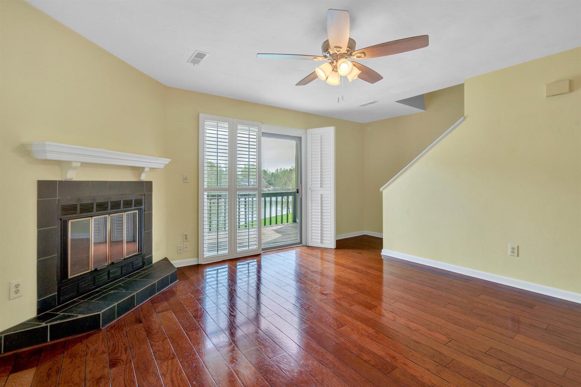 202 Harbor Ridge Drive Goodview, VA 24095 - Photo 10 of 30 a view of an empty room with wooden floor and a window