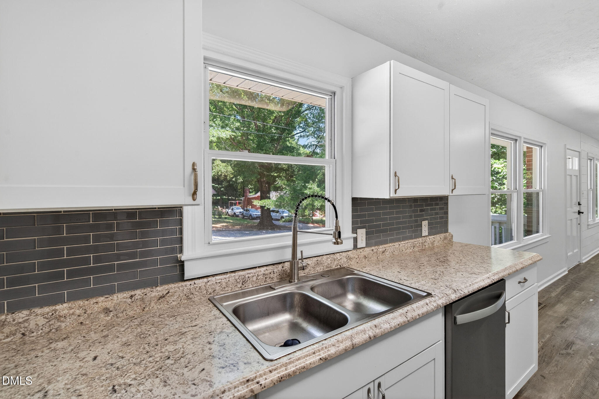904 Seabrook Road Raleigh, NC 27610 - Photo 8 of 31 a kitchen with granite countertop a sink and a stove