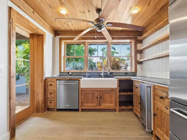 a view of a kitchen with a sink and a window