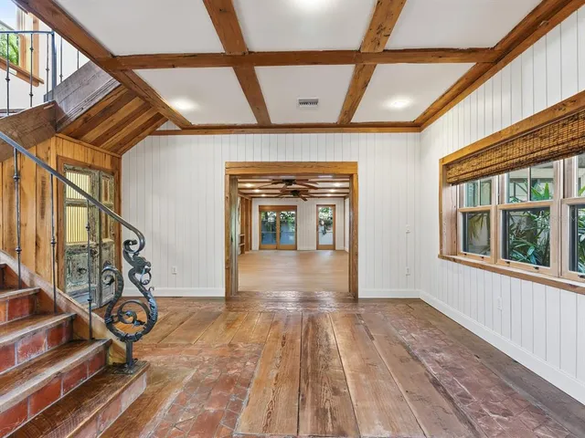 a view of an entryway with wooden floor