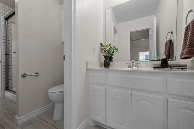 a bathroom with a sink and toilet