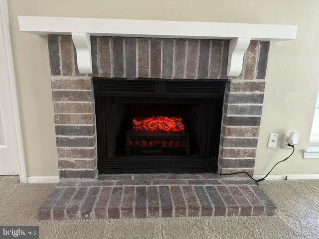 602 Squire Lane, Unit D Bel Air, MD 21014 - Photo 14 of 28 a living room with a fireplace