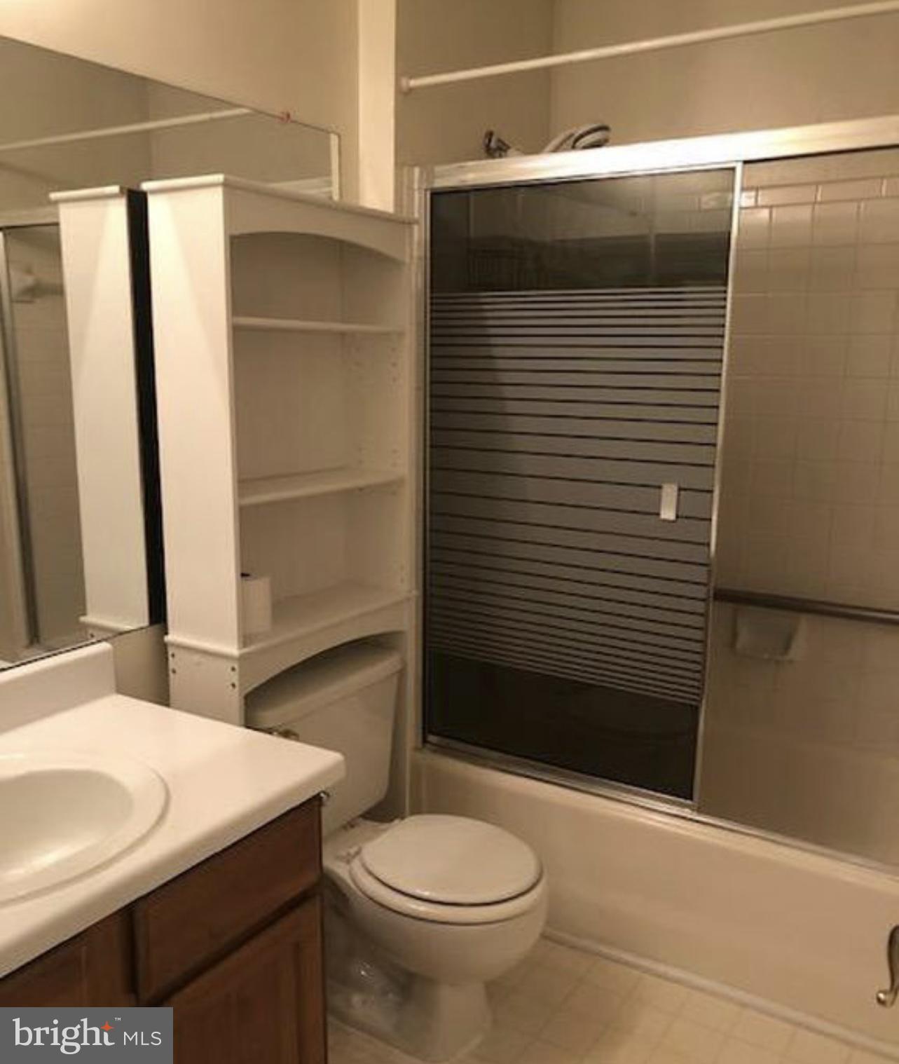 602 Squire Lane, Unit D Bel Air, MD 21014 - Photo 22 of 28 a bathroom with a sink a toilet and shower