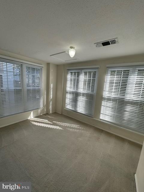 602 Squire Lane, Unit D Bel Air, MD 21014 - Photo 25 of 28 an empty room with wooden floor and windows