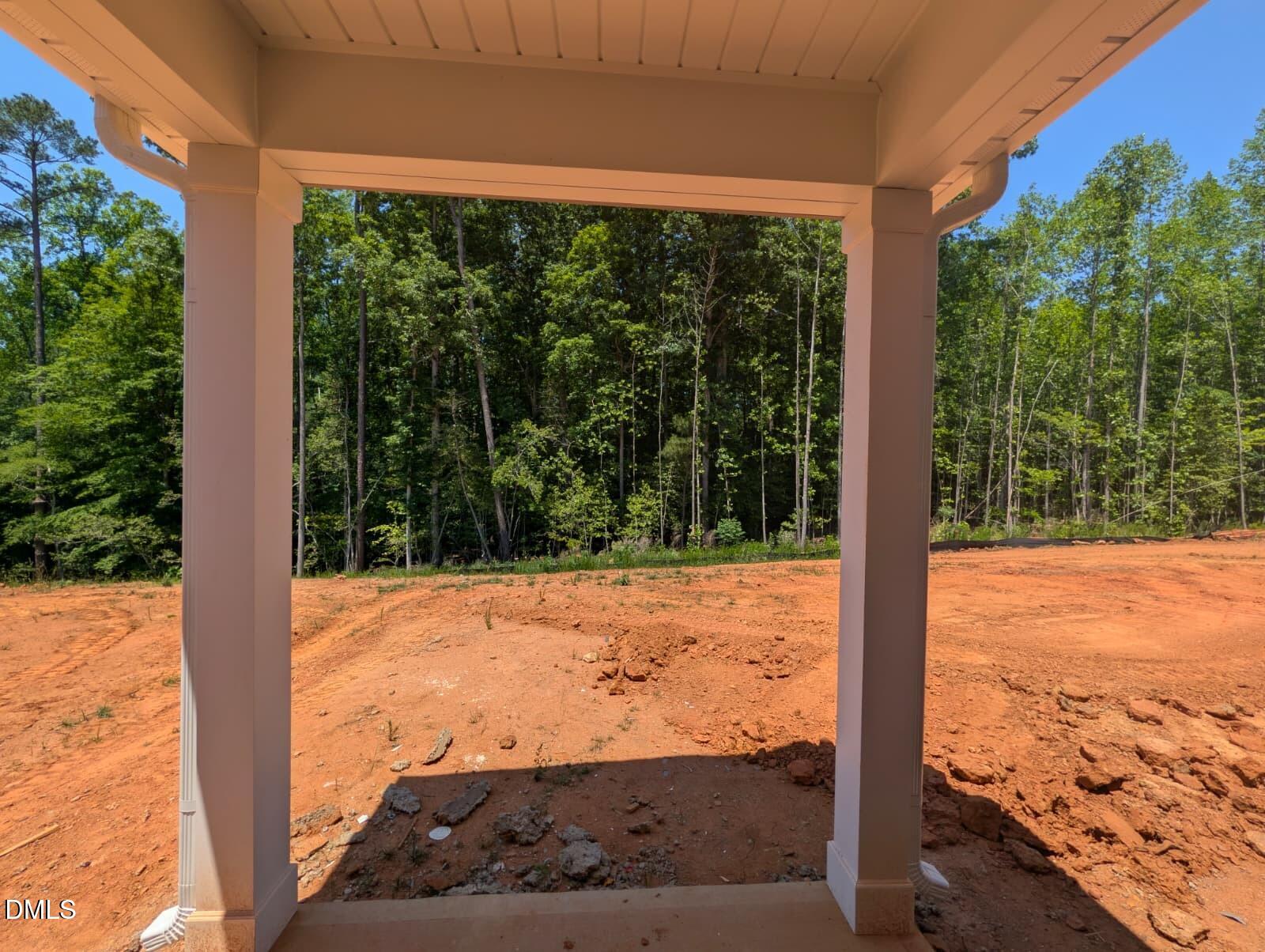 308 Karlov Road Garner, NC 27529 - Photo 35 of 55 a view of a yard with wooden floor and a floor to ceiling window