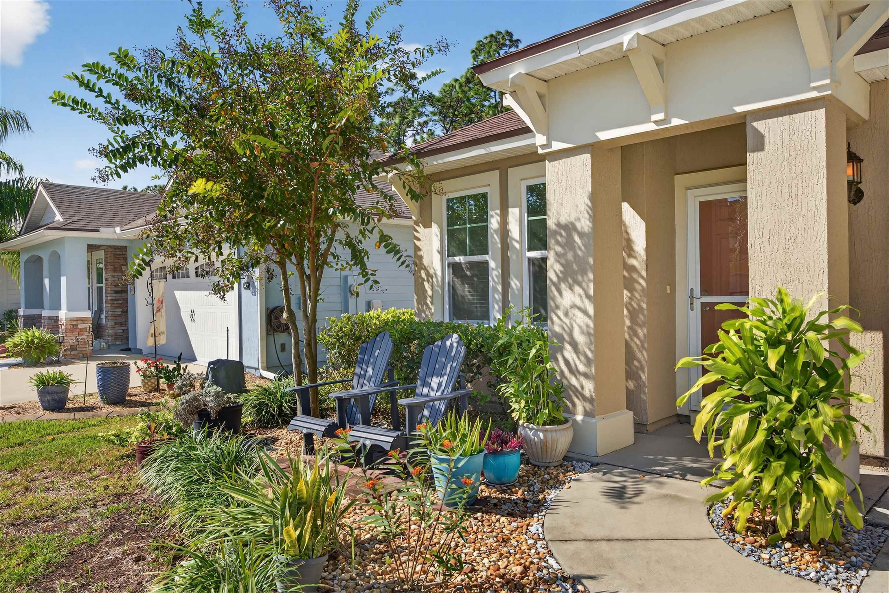 415 Balearics Drive St. Augustine, FL 32086 - Photo 4 of 30 a potted plant sitting in front of a house