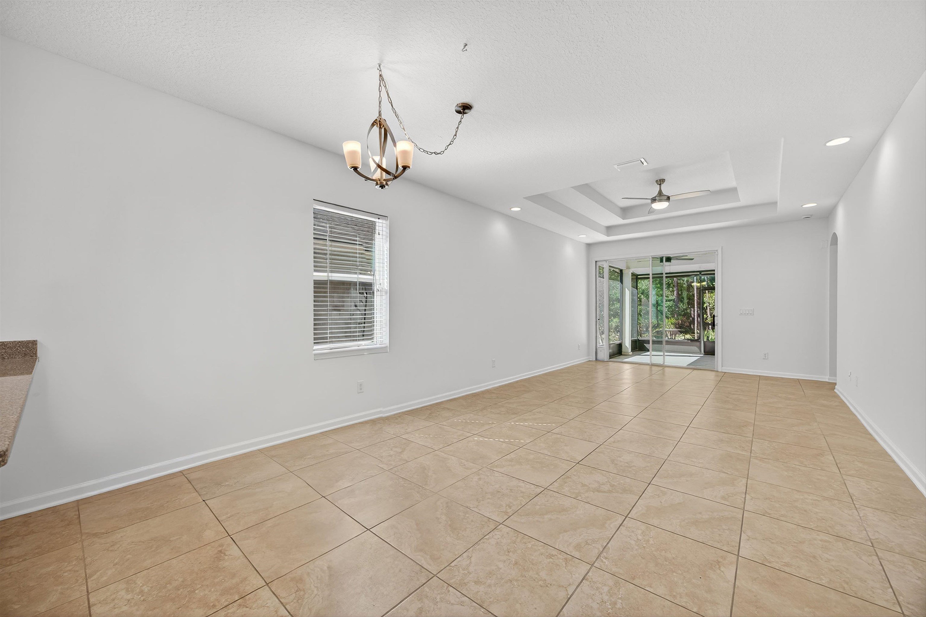 415 Balearics Drive St. Augustine, FL 32086 - Photo 7 of 30 an empty room with windows and ceiling fan