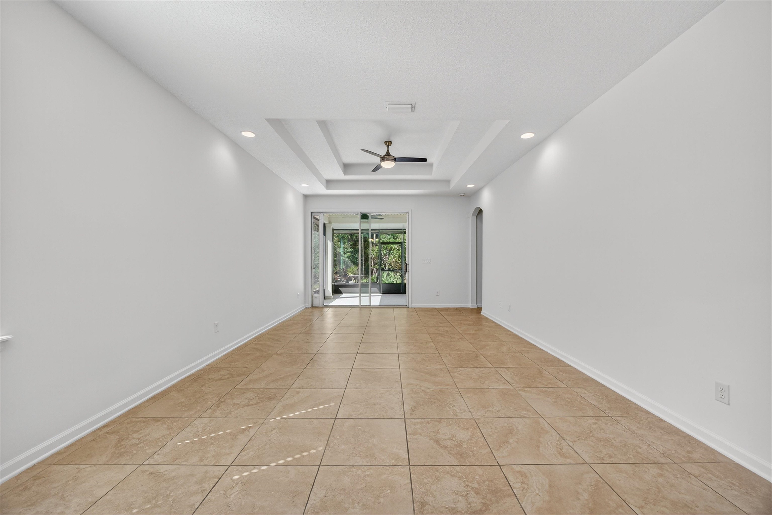 415 Balearics Drive St. Augustine, FL 32086 - Photo 8 of 30 wooden floor in an empty room with a window