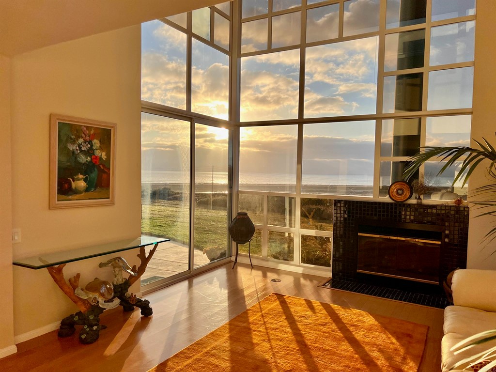 a living room with a large window and gym equipment
