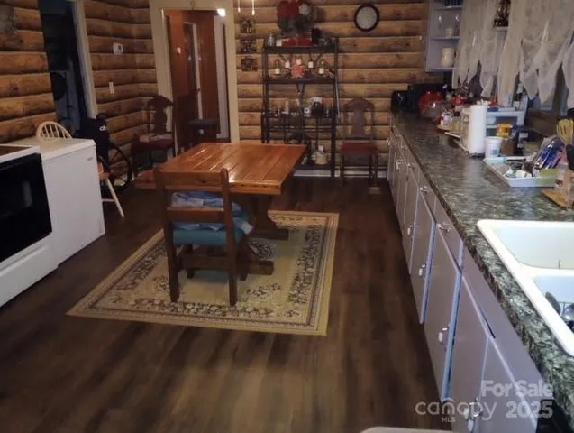 a balcony with table and chairs