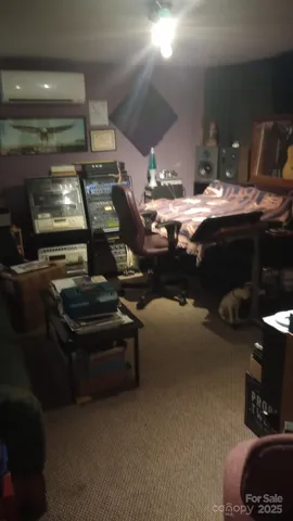 a room with furniture and flat screen tv