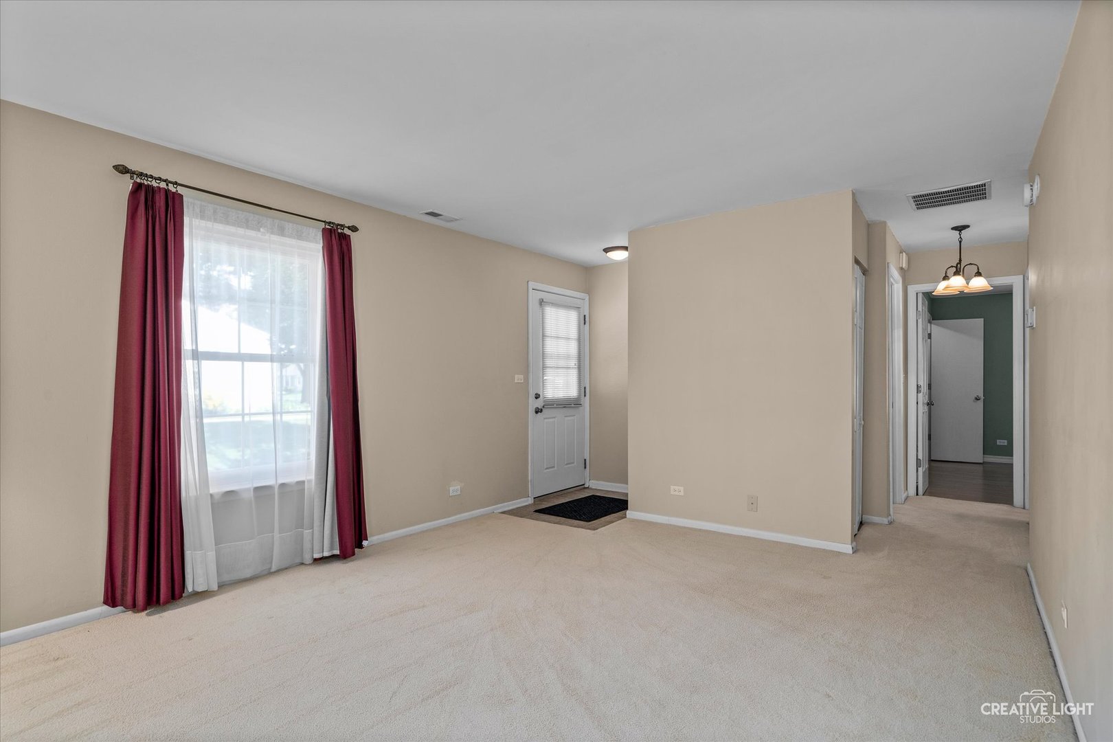 1489 Woodcutter Lane, Unit A Wheaton, IL 60189 - Photo 4 of 20 an empty room with windows and bathroom view