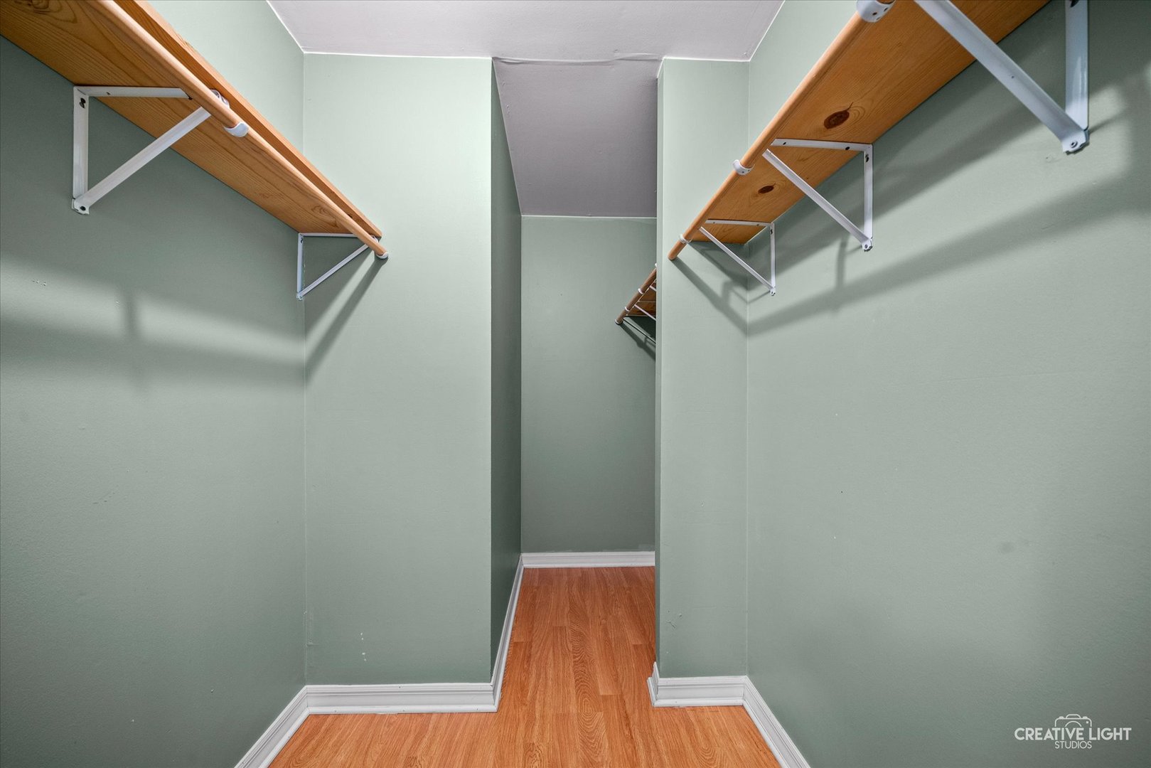 1489 Woodcutter Lane, Unit A Wheaton, IL 60189 - Photo 10 of 20 a view of a hallway with wooden floor and stairs