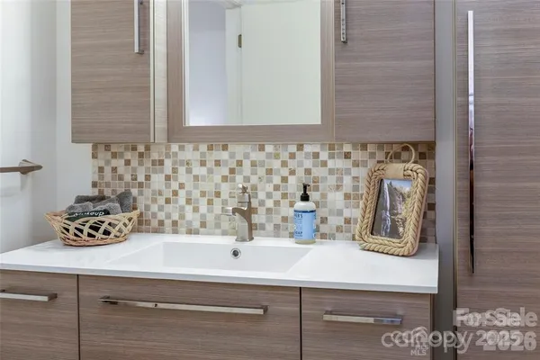 a living room with a bed furniture and a garden