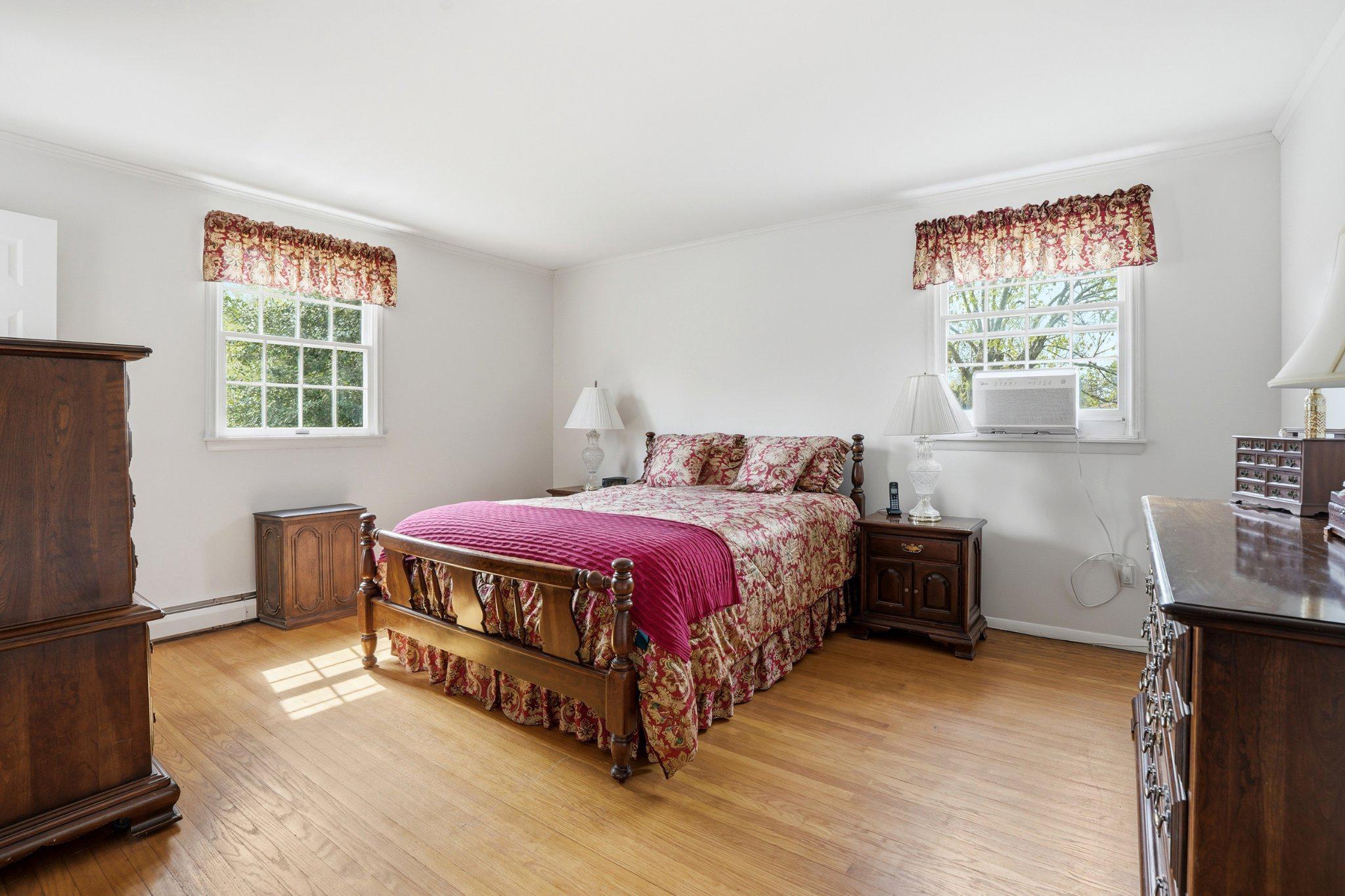 1624 Dillon Road Ambler, PA 19002 - Photo 13 of 47 a spacious bedroom with a bed and wooden floor
