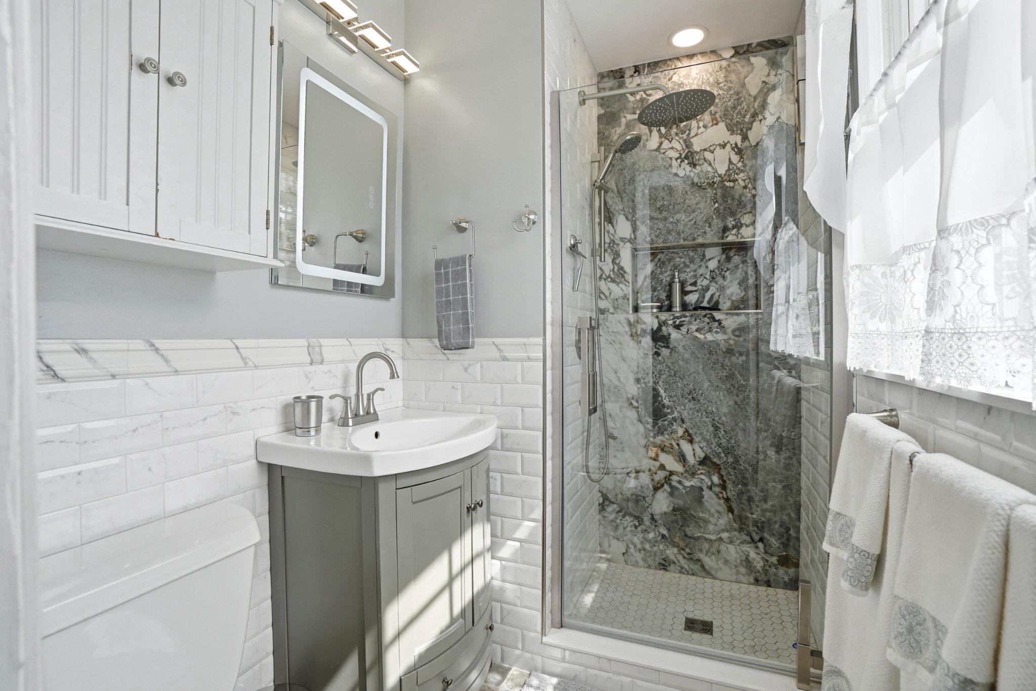1624 Dillon Road Ambler, PA 19002 - Photo 15 of 47 a bathroom with a shower a mirror and a sink