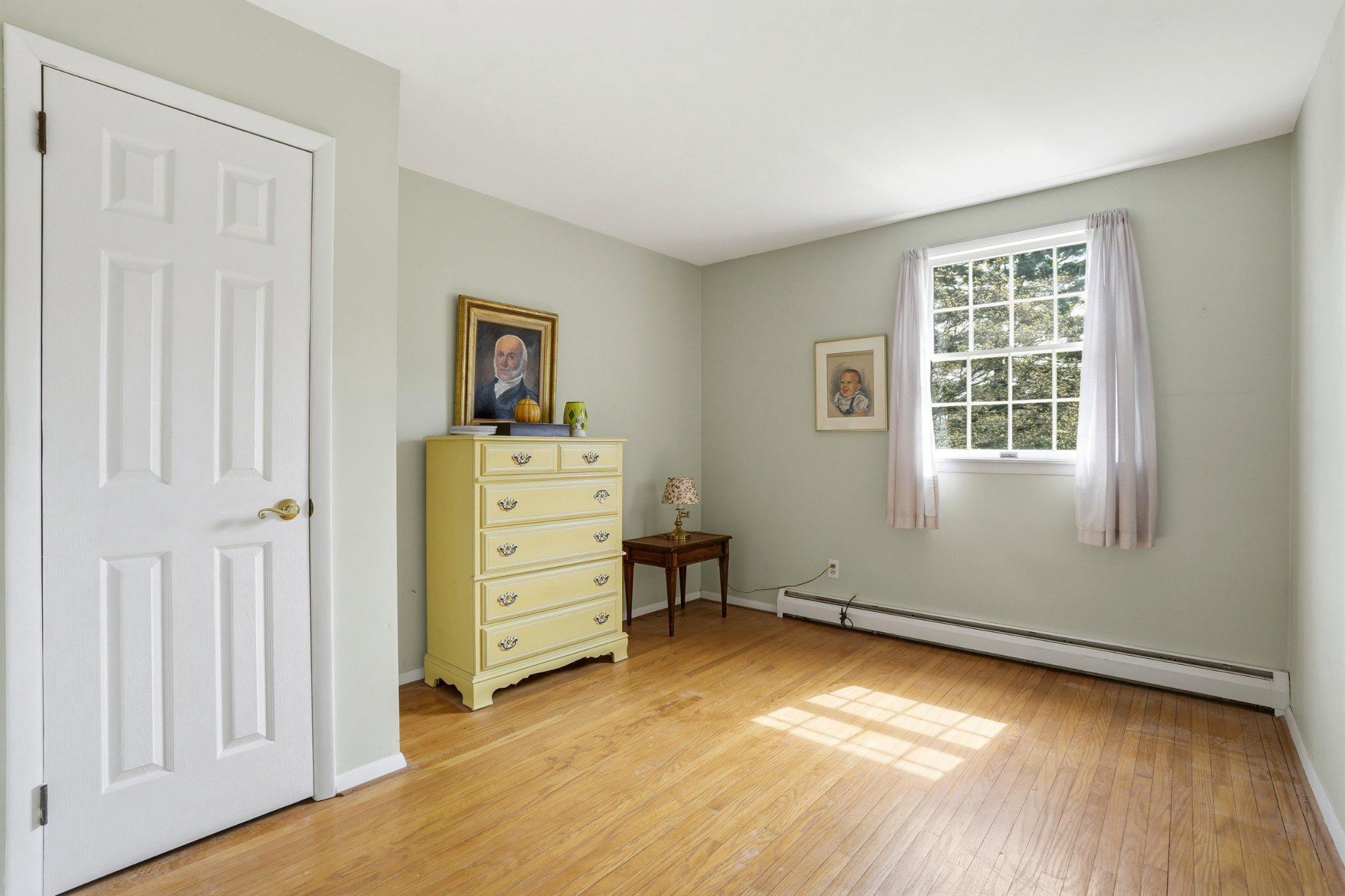 1624 Dillon Road Ambler, PA 19002 - Photo 16 of 47 a view of a bedroom with closet window and a wooden floor