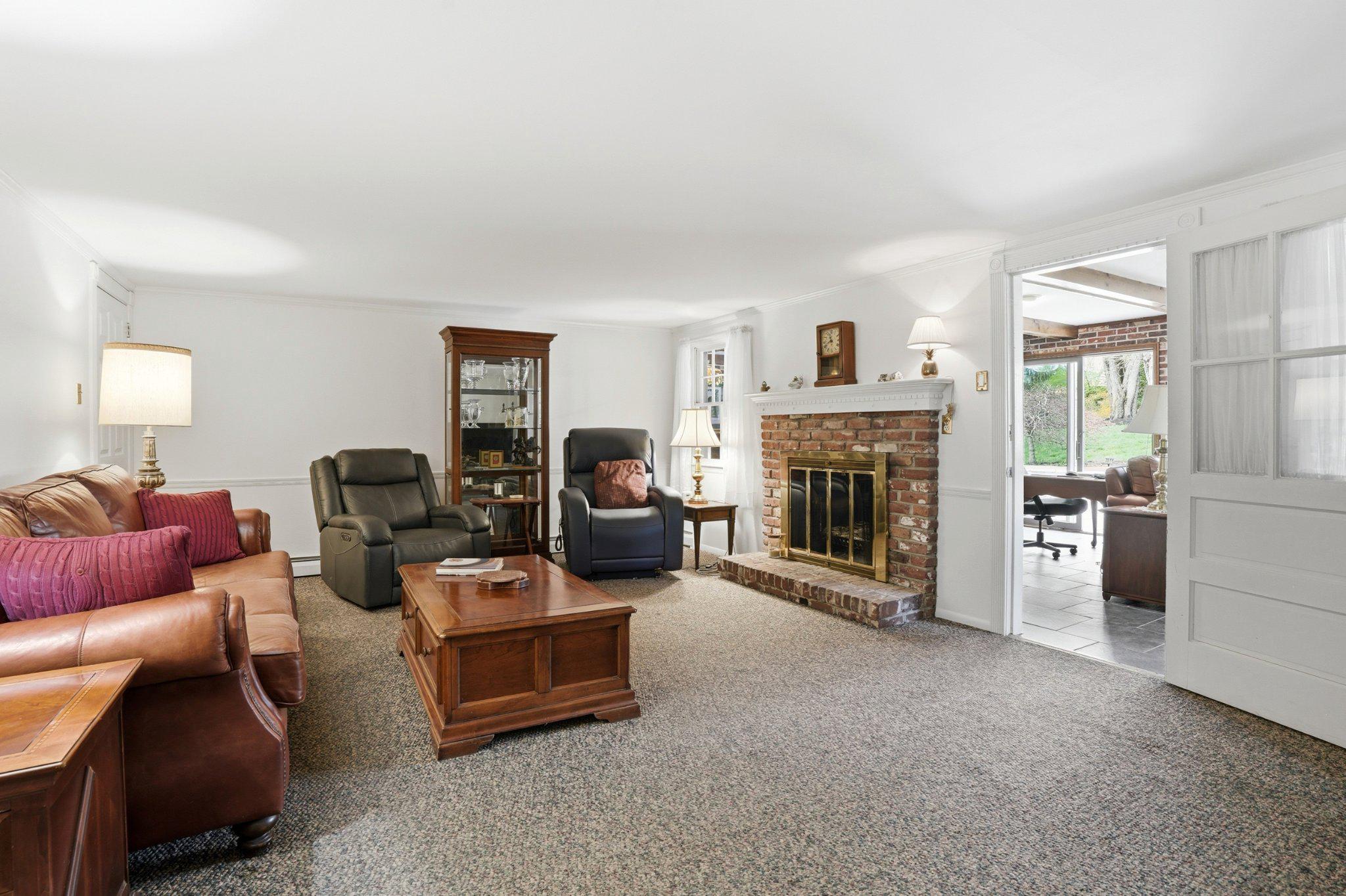 1624 Dillon Road Ambler, PA 19002 - Photo 31 of 47 a living room with furniture and a fireplace