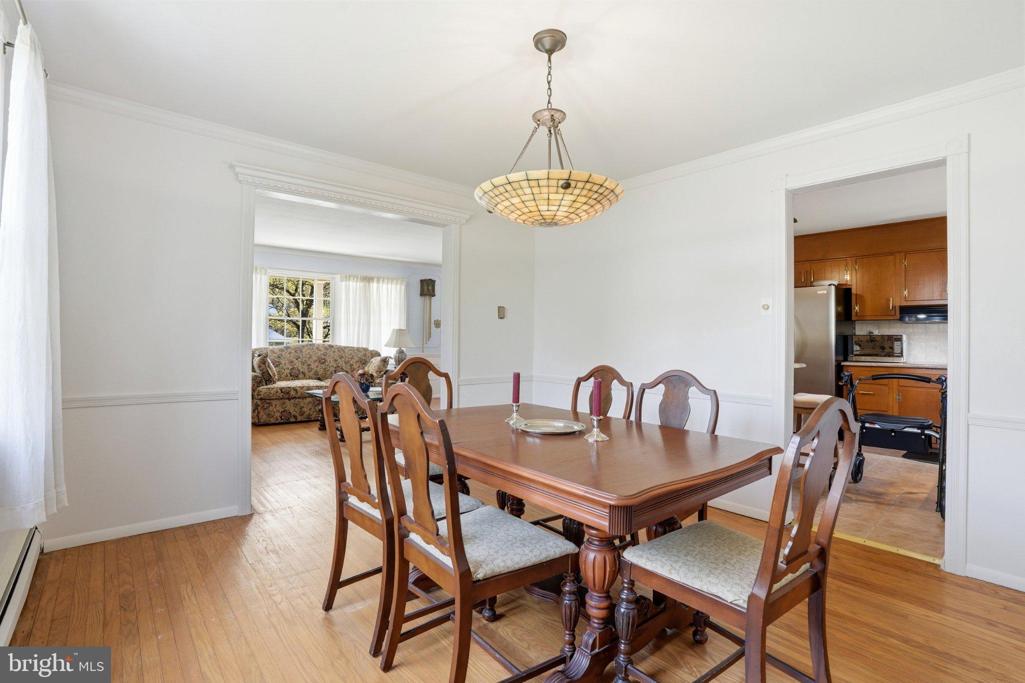 1624 Dillon Road Ambler, PA 19002 - Photo 9 of 47 a dining room with furniture a chandelier and wooden floor
