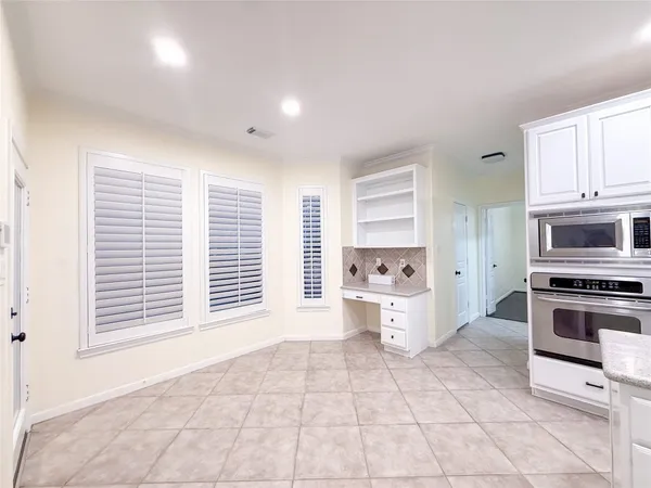 a kitchen with a stove a sink and a refrigerator