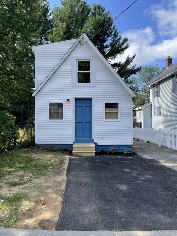 408 Nottingham Street Springfield, MA 01104 - Photo 1 of 12 a view of a house with a yard