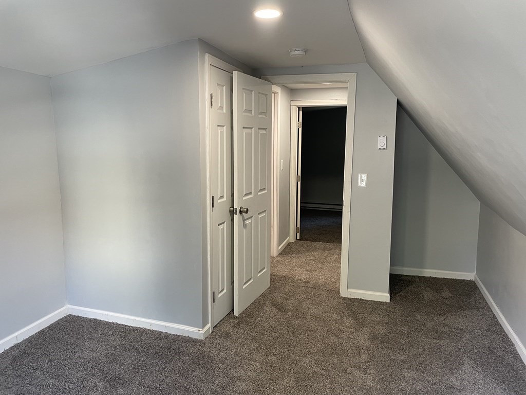 408 Nottingham Street Springfield, MA 01104 - Photo 11 of 12 wooden floor and closet in a room