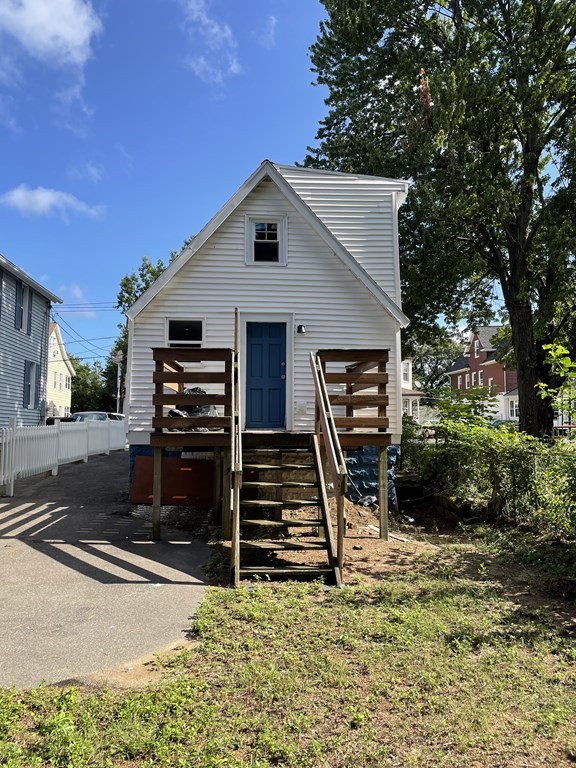 408 Nottingham Street Springfield, MA 01104 - Photo 2 of 12 a view of a house with a yard