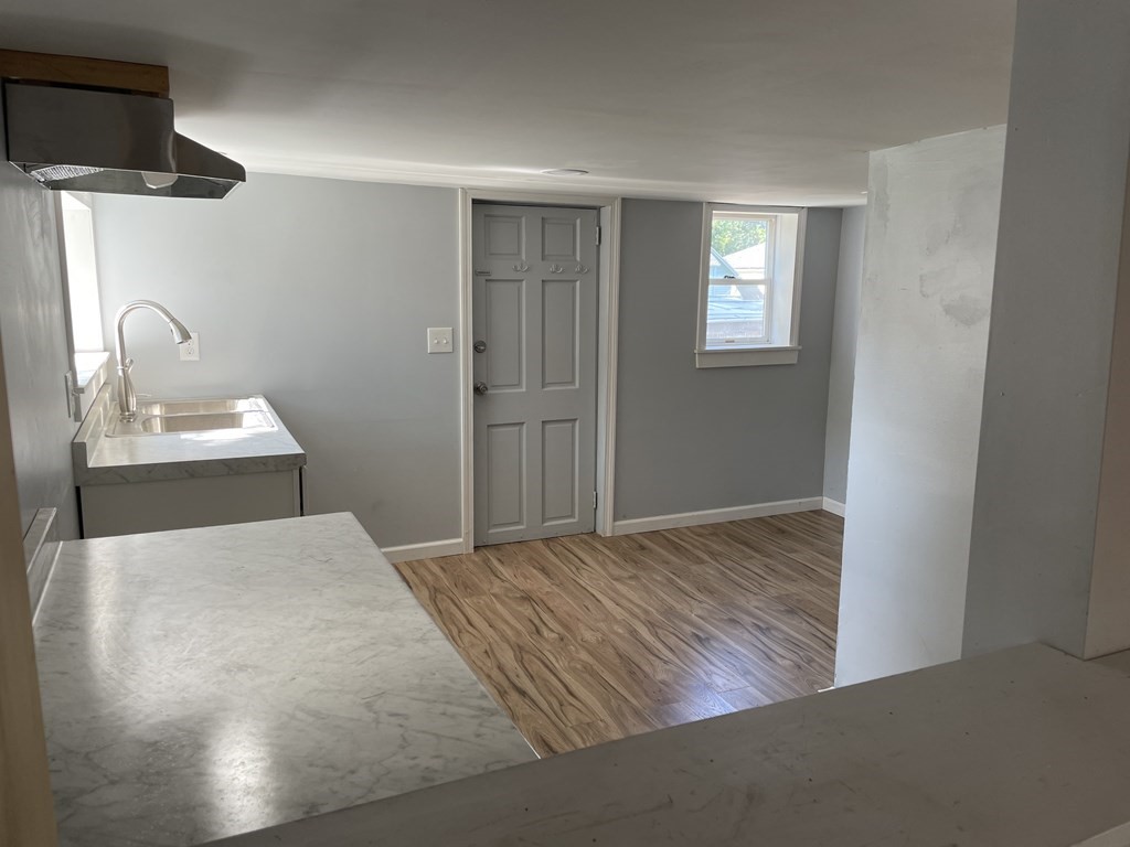 408 Nottingham Street Springfield, MA 01104 - Photo 5 of 12 a bedroom with a bed and a night stand