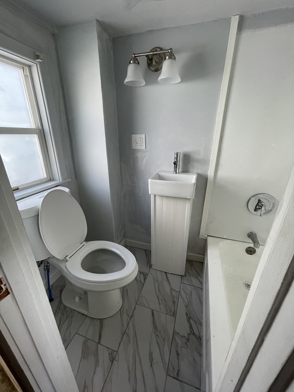 408 Nottingham Street Springfield, MA 01104 - Photo 6 of 12 a bathroom with a toilet and a sink